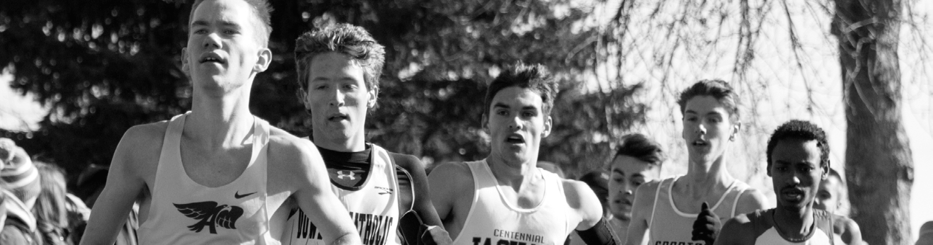 Young men running during a cross country meet
