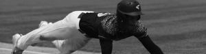 Player sliding during a game of baseball