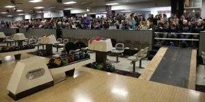 Friends and family watching a bowling match