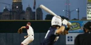 Pitcher getting ready to throw the ball during a baseball game