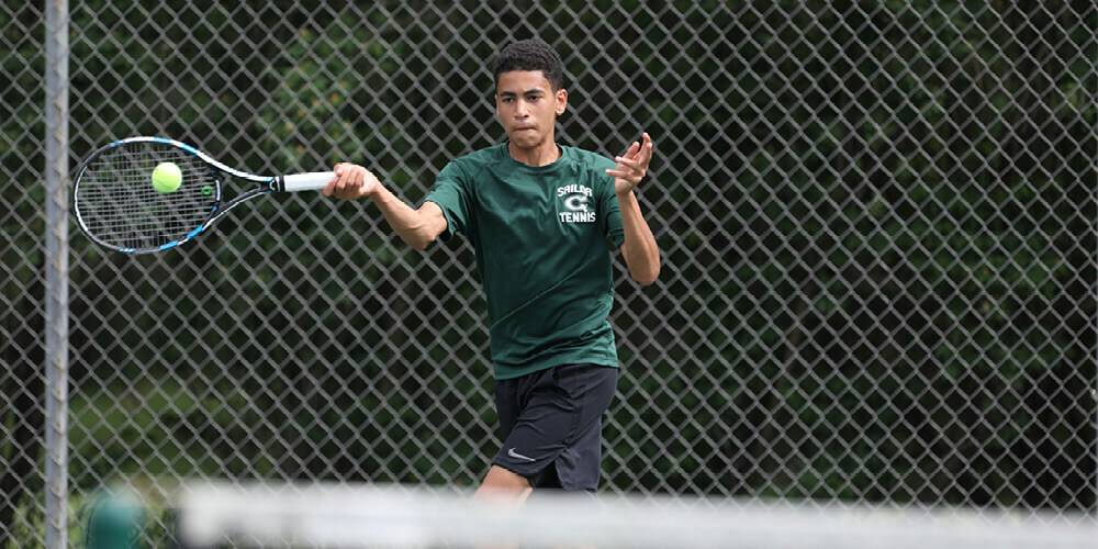 Tennis player hitting the ball mid-action