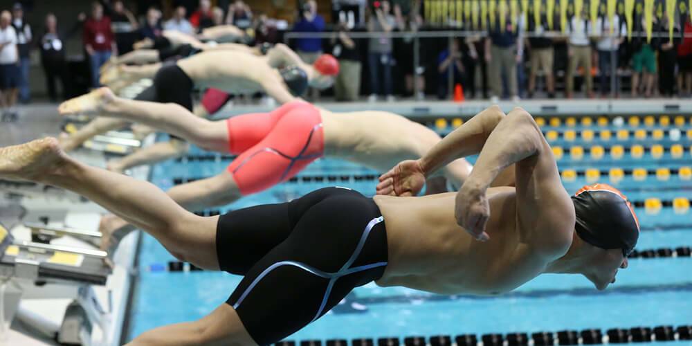 Close up shot of a swimmer diving into the water