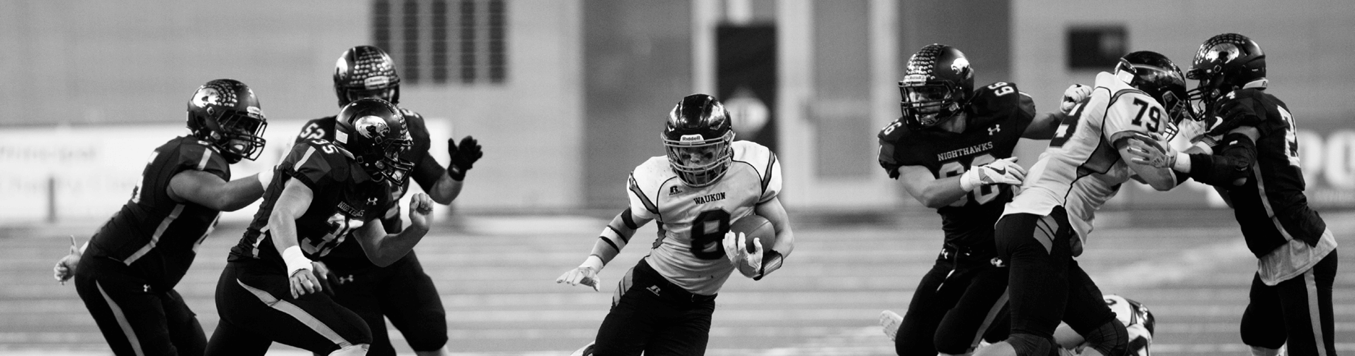 Horizontal image of young men playing football