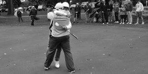 Image of two guys hugging during a round of golf