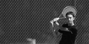 Image of a young man playing tennis