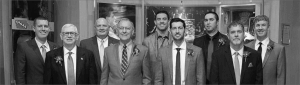 a picture of nine men in business suits