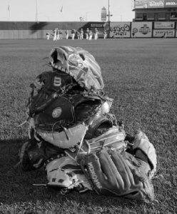 a pile of baseball mitts