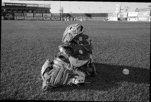 a pile of baseball mitts