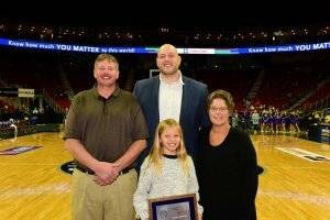 a family accepting an award