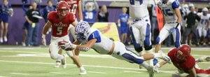 a football player diving for a ball